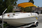 yellow bimini top on a Chaparral boat