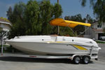 yellow bimini top on a Chaparral boat