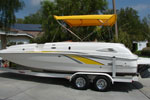 yellow bimini top on a Chaparral boat